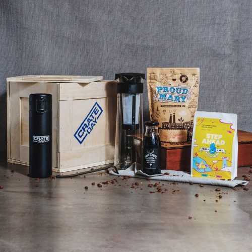 Coffee Hamper. Coffee beans, cold brew filter, espresso martini and thermos in a wooden crate with pry bar.