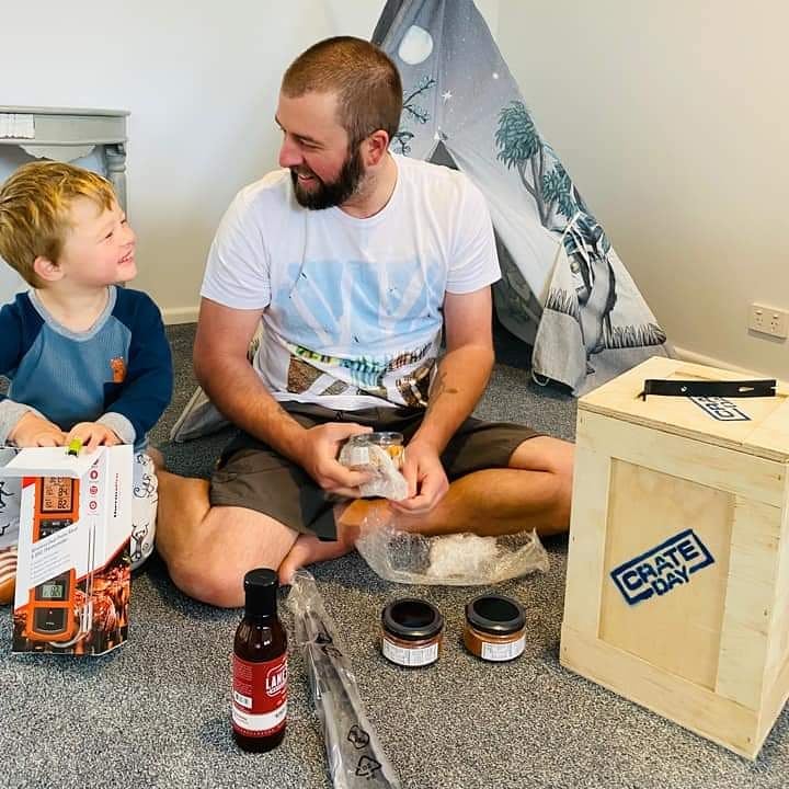 Father and son with a BBQ gift crate