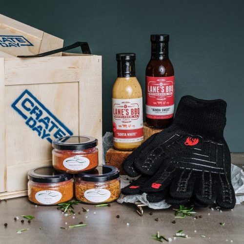 BBQ gift set of spices, sauces and mitts in a wooden crate